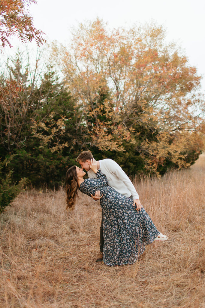 In the soft, creamy light of the setting sun, a couple shares a tender moment, beautifully preserved in their engagement photos.