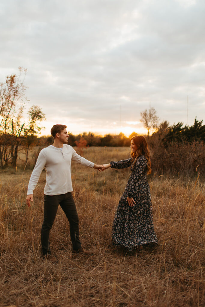 Couple dancing at great plains nature center as the sun sets