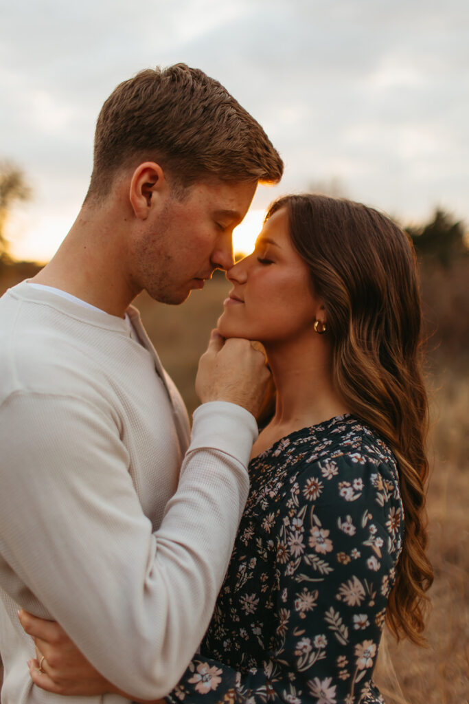 Romantic golden hour engagement photos with the couple bathed in the warm hues of the setting sun.