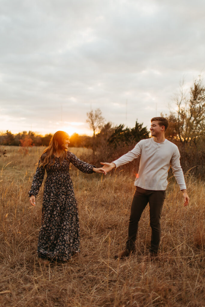 Romantic golden hour engagement photos with the couple bathed in the warm hues of the setting sun.