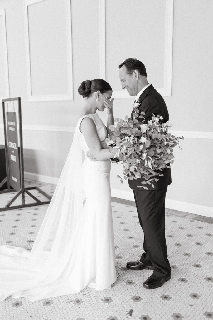 An emotional first look with the bride and her father