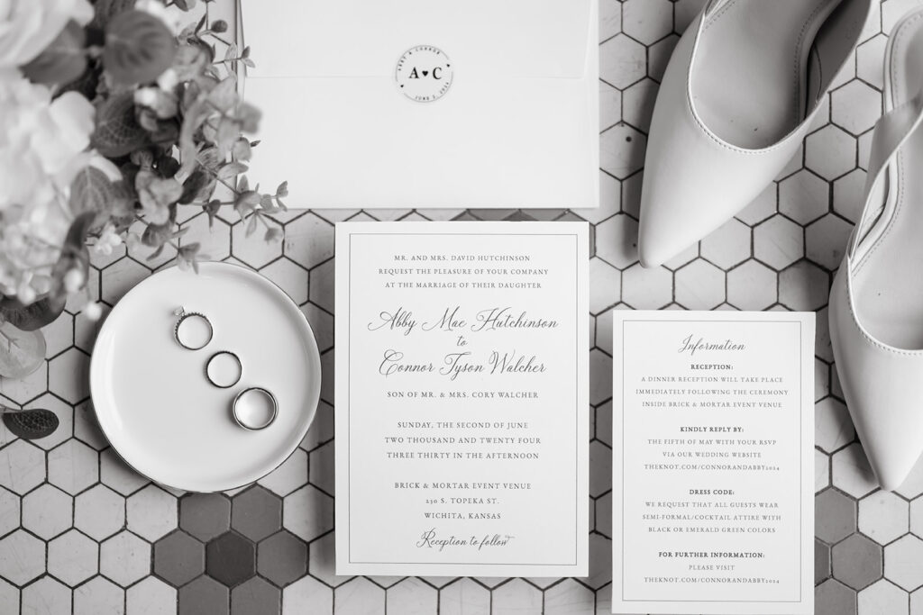 Classy white wedding details in a flat lay