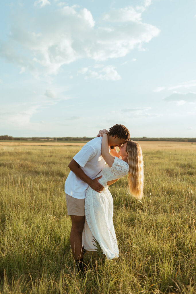 A couple taking their summer engagement photos in Kansas