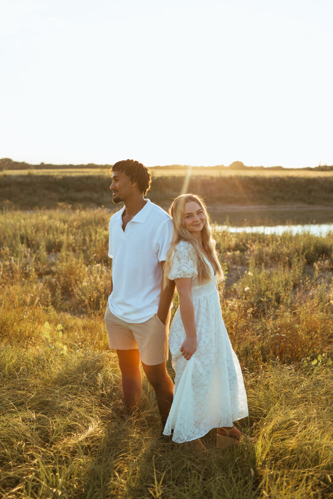 A couple taking their summer engagement photos in Kansas