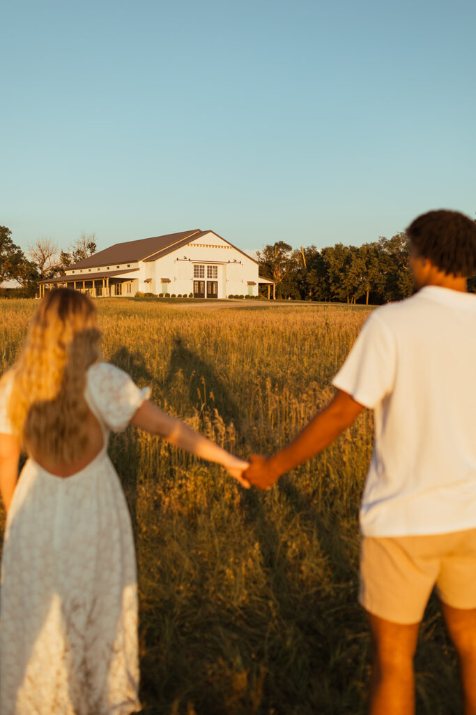 The Barn at Grace Hill, peeping in the background during a couples summer engagement photos