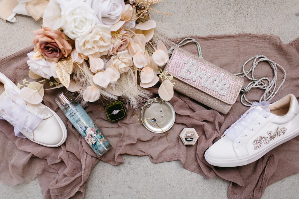 Mauve colored bride details laying for a flat lay shot