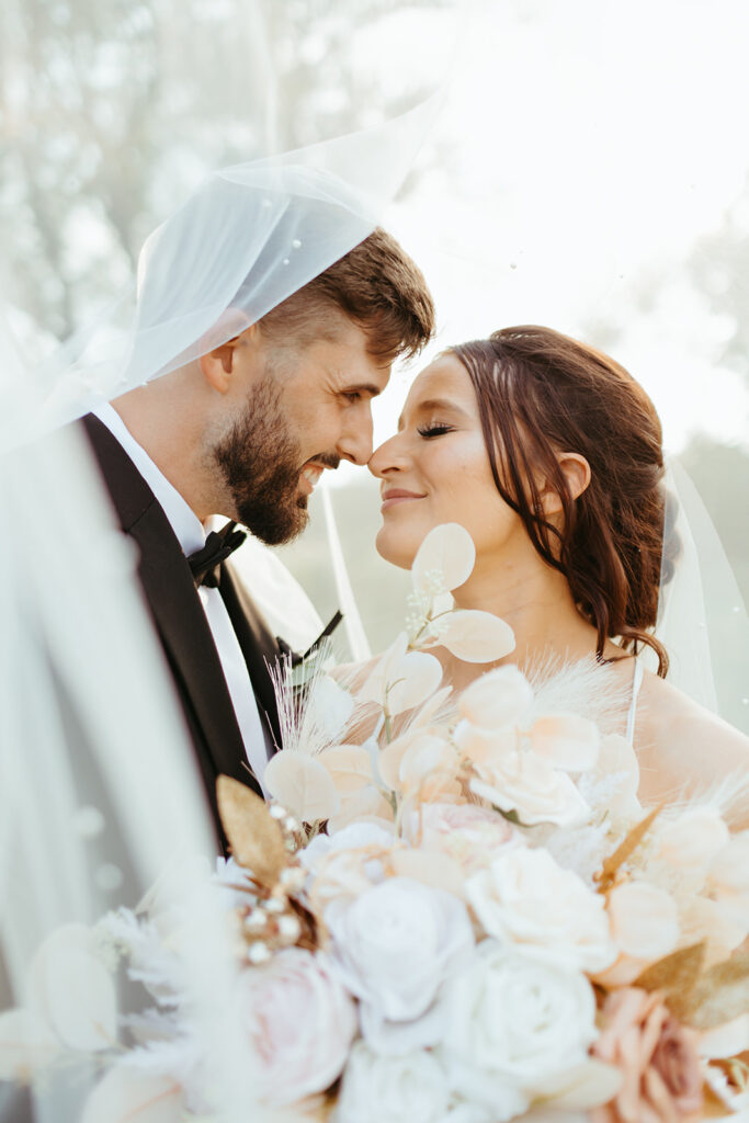 Sunset bridal portraits through the veil