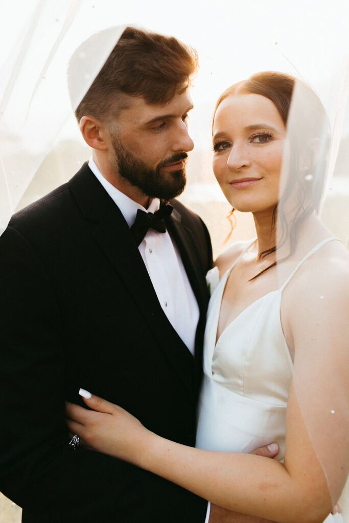 Sunset bridal portraits through the veil