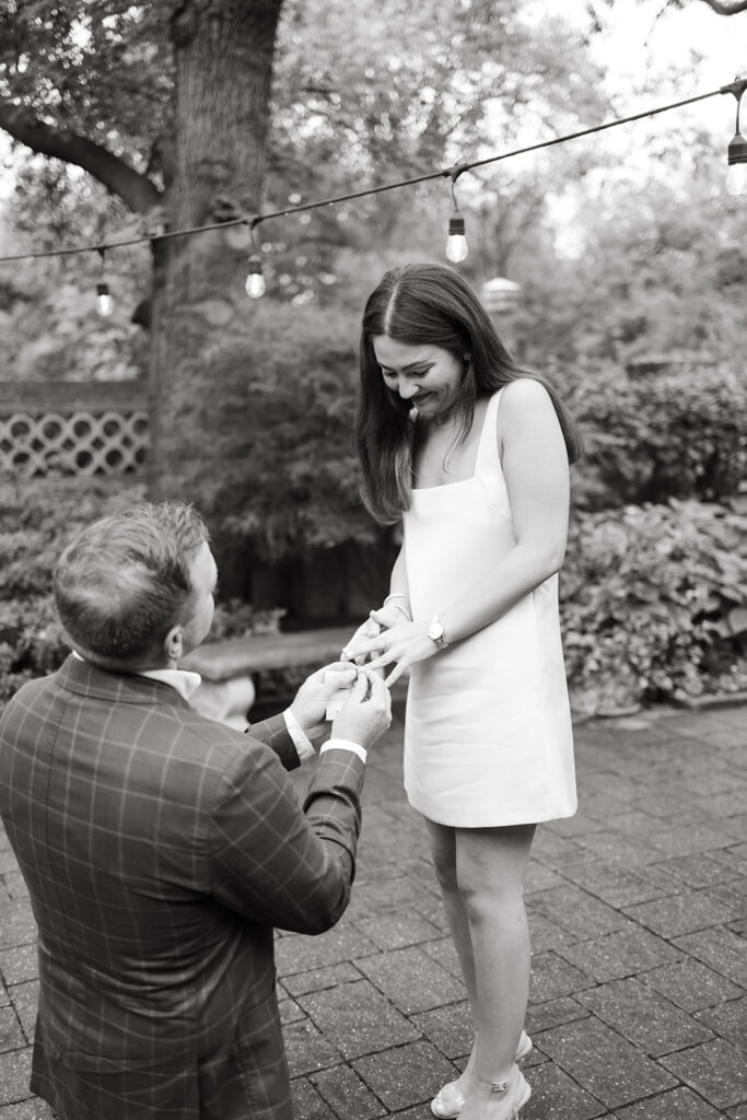 An emotional surprise proposal in a stunning backyard garden