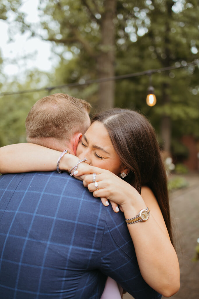 An emotional surprise proposal in a stunning backyard garden