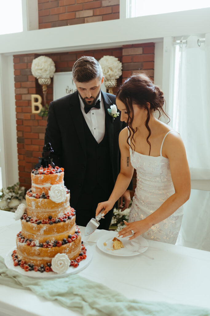 Bride and groom cut their cake at their 90s style cake reception