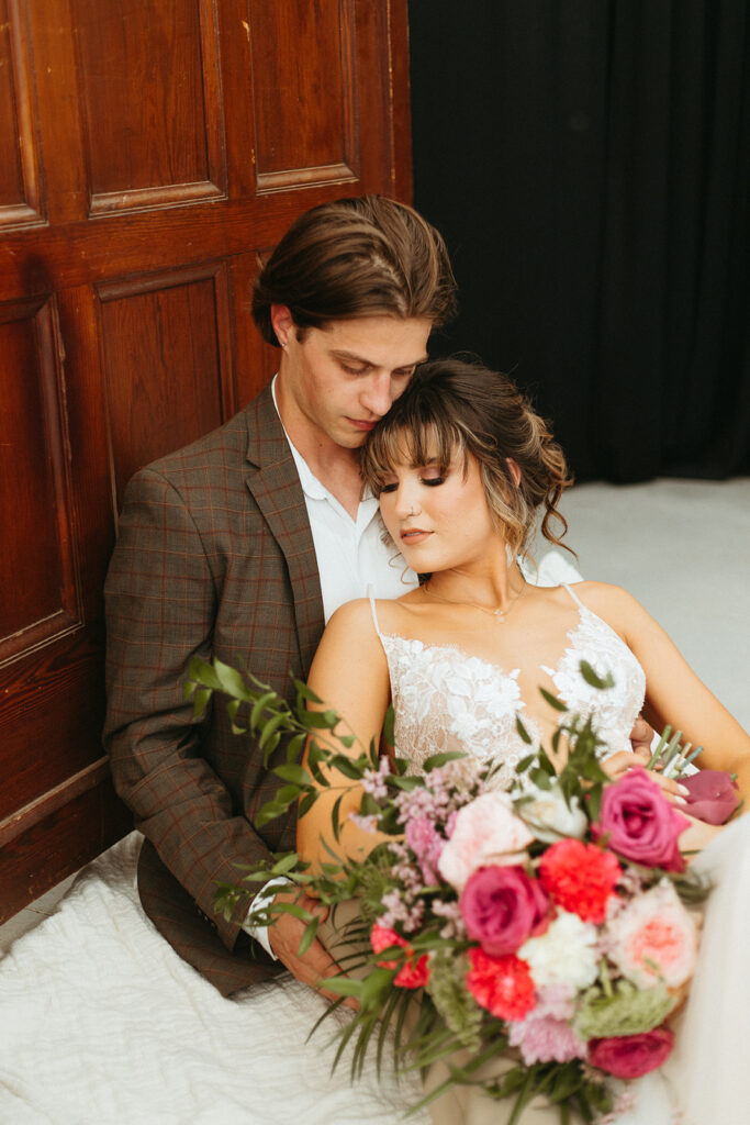 Bride and groom portraits in the greenhouse at Atreeum in Wichita