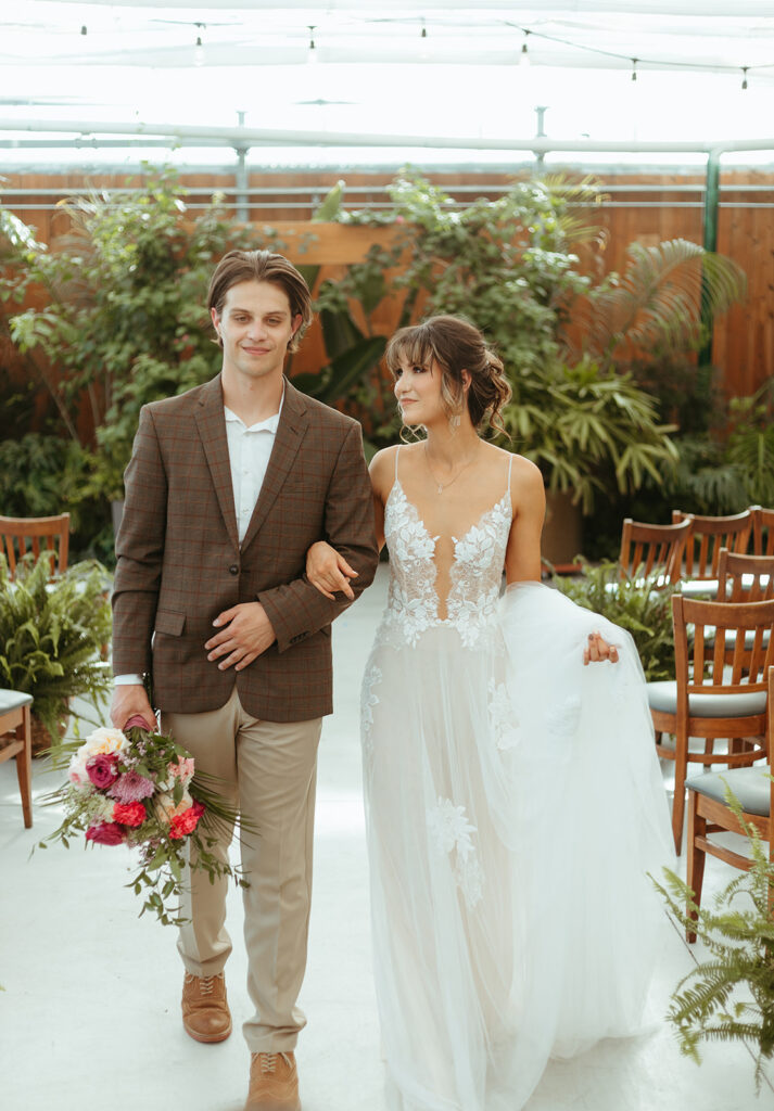 Bride and groom portraits in the greenhouse at Atreeum in Wichita