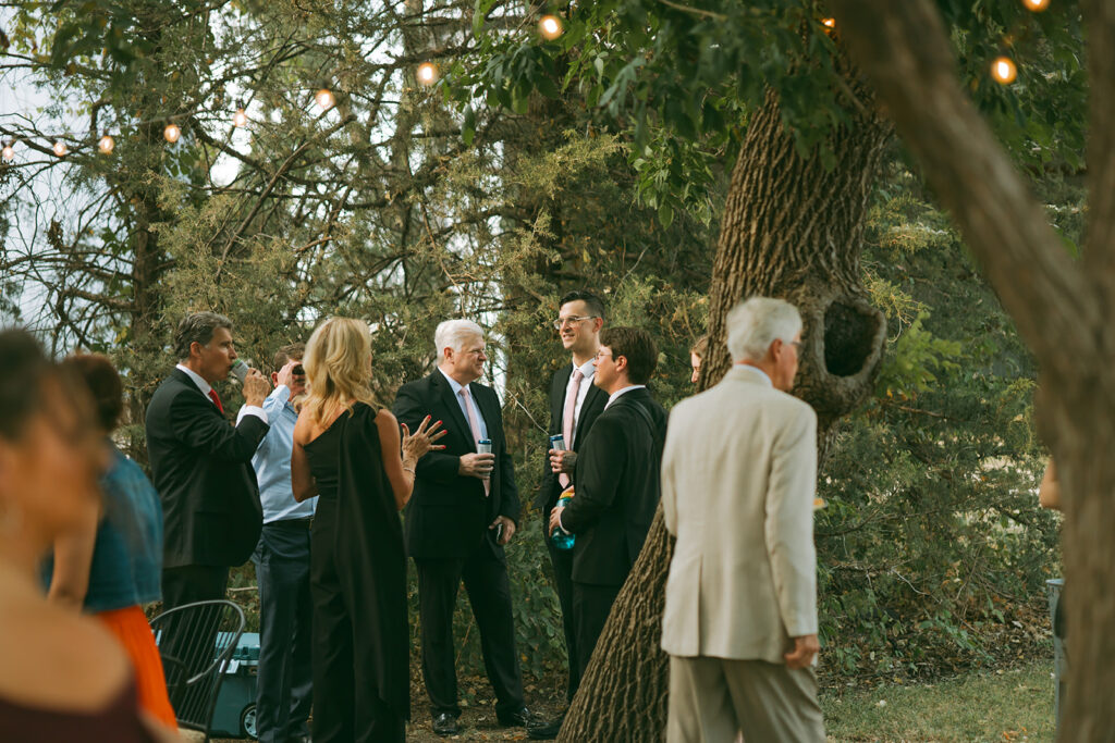 Cocktail hour before the outdoor backyard wedding ceremony 