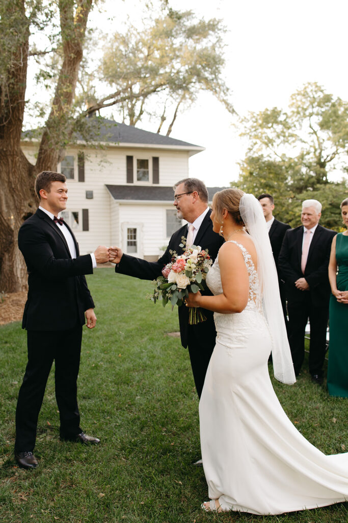 An outdoor backyard wedding ceremony near Wichita, Kansas