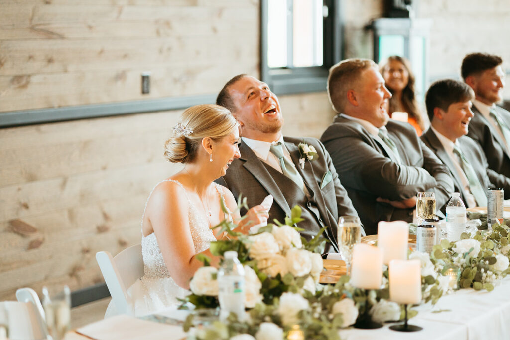 Photographer captures bride and groom laughing