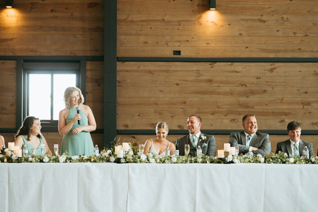 Second Photographer captures maid of honor giving a speech