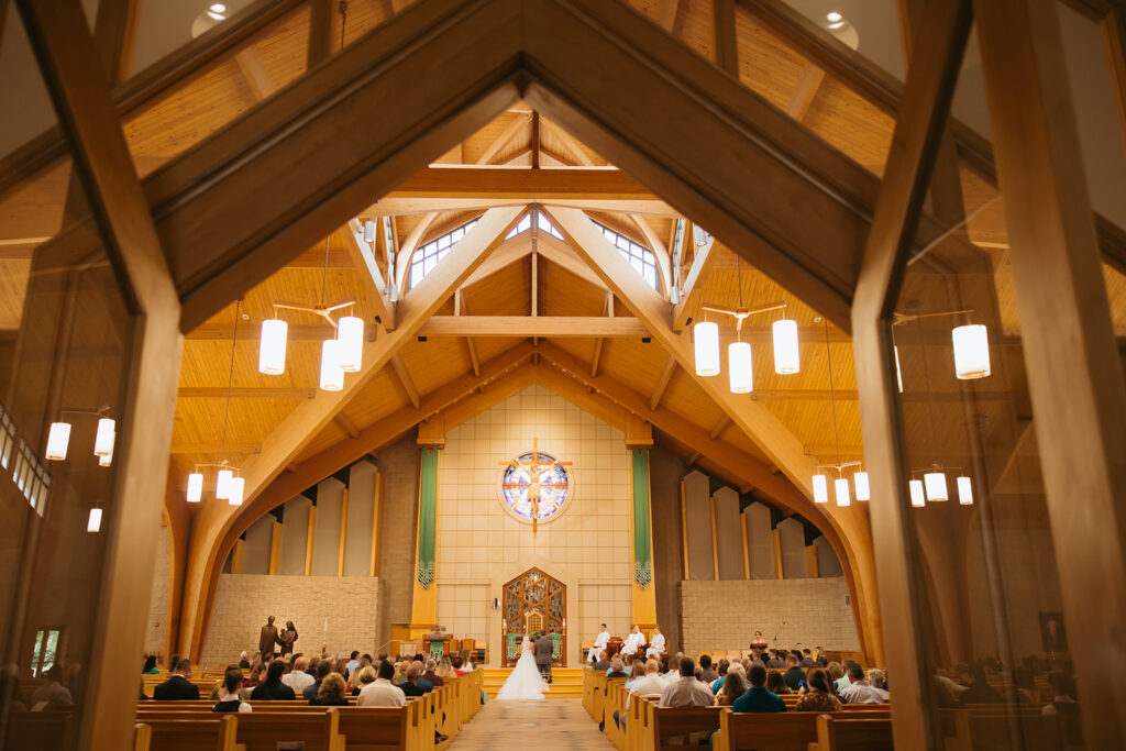 Second Photographer captures bride and groom at the altar from far away