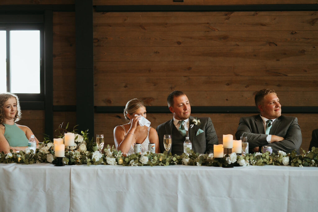 Second Photographer captures bride and groom crying at a speech