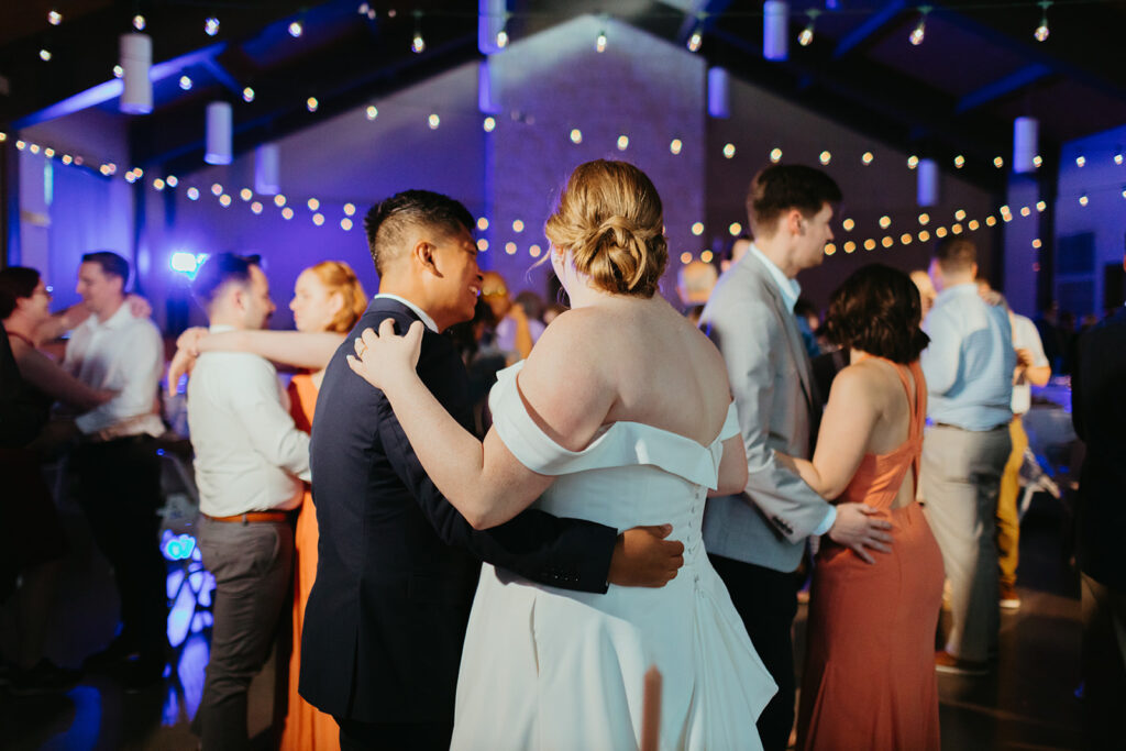 A wedding planner assists with the timeline of the wedding reception and cueing music